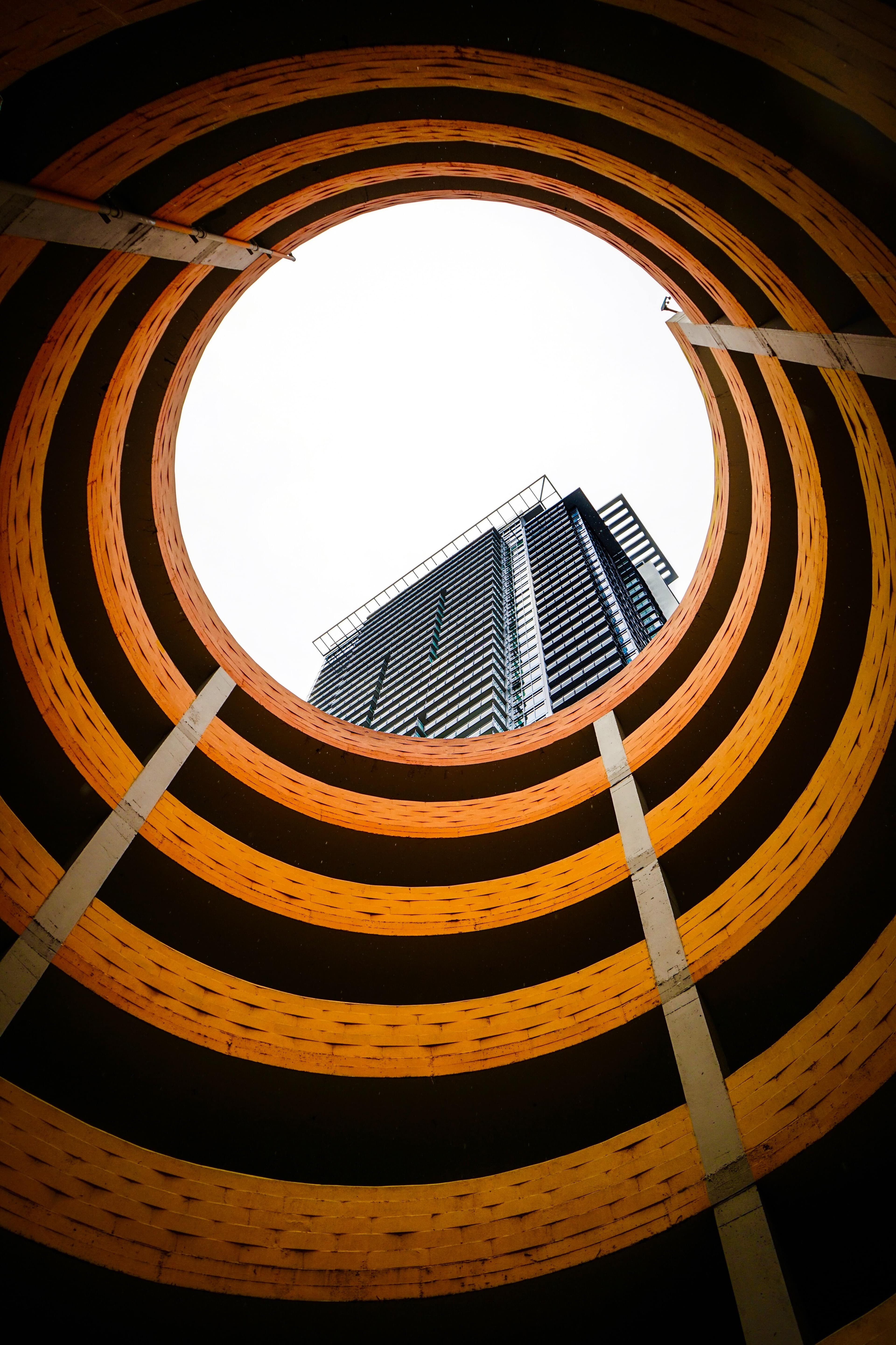 Photographic image of a tunnel with skyscraper
