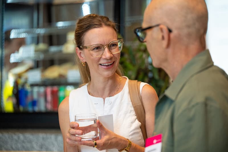 Photo of two people talking Cicada Innovations