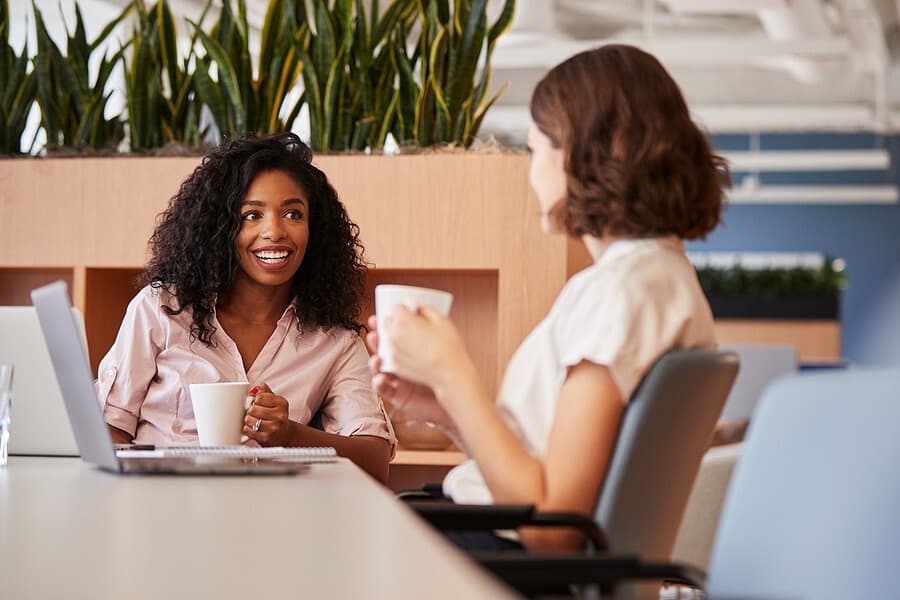 Two people talking at work